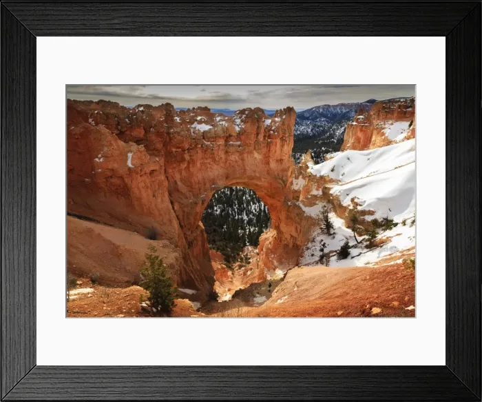 Framed Print : Red-hued limestone arch lit by morning sun with snowy cliffs in winter at Natural Bridge, Bryce Canyon National Park, Utah, United States of America, North America Framed Print : Red-hued limestone arch lit by morning sun with snowy cliffs in winter at Natural Bridge, Bryce Canyon National Park, Utah, United States of America, North America