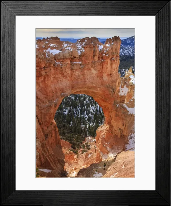 Framed Print : Red-hued limestone arch lit by morning sun with snow in winter at Natural Bridge, Bryce Canyon National Park, Utah, United States of America, North America Framed Print : Red-hued limestone arch lit by morning sun with snow in winter at Natural Bridge, Bryce Canyon National Park, Utah, United States of America, North America