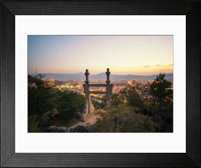 Framed Print : Stone gate in the mountains above Lijiang with foliage in the foreground and city lights in the background, Yunnan, China, Asia Framed Print : Stone gate in the mountains above Lijiang with foliage in the foreground and city lights in the background, Yunnan, China, Asia