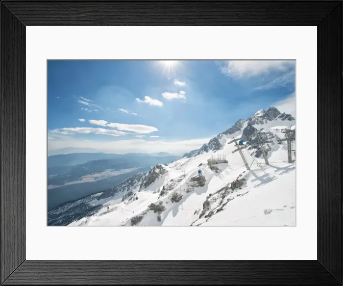 Framed Print : Jade Dragon Snow Mountain with blue cable cars and view on the lower regions of Yunnan, China, Asia Framed Print : Jade Dragon Snow Mountain with blue cable cars and view on the lower regions of Yunnan, China, Asia