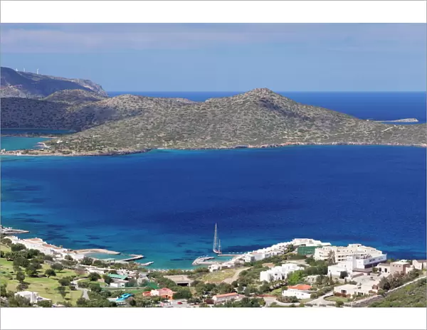 Coast and resort of Elounda, Spinalonga Island, Gulf of Mirabello, Crete, Greek Islands, Greece, Europe