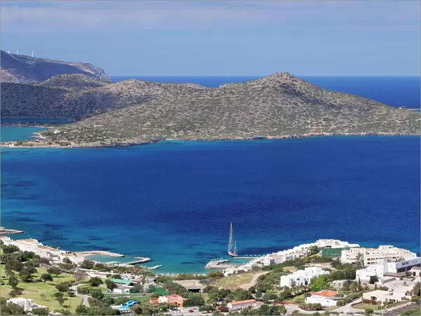 Coast and resort of Elounda, Spinalonga Island, Gulf of Mirabello, Crete, Greek Islands, Greece, Europe