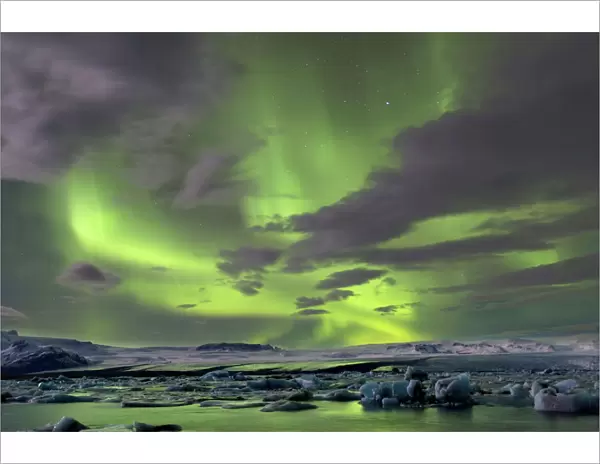 The Aurora Borealis (Northern Lights) captured in the night sky over Jokulsarlon glacial lagoon on the edge of the Vatnajokull National Park, during winter, South Iceland, Iceland, Polar Regions