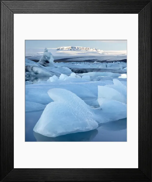 Framed Print : View over Jokulsarlon, a glacial lagoon at the head of the Breidamerkurjokull Glacier, towards icebergs and snow-capped mountains, with reflections in the calm water of the lagoon on a winters afternoon, on the edge of the Vatnajokull National Park, South Iceland, Iceland, Polar Regions Framed Print : View over Jokulsarlon, a glacial lagoon at the head of the Breidamerkurjokull Glacier, towards icebergs and snow-capped mountains, with reflections in the calm water of the lagoon on a winters afternoon, on the edge of the Vatnajokull National Park, South Iceland, Iceland, Polar Regions