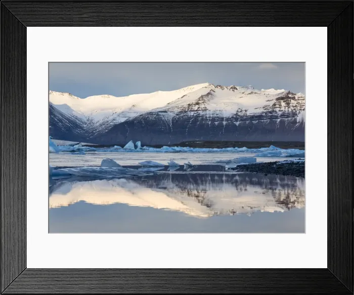 Framed Print : View over Jokulsarlon glacial lagoon towards snow-capped mountains and icebergs, with reflections in the calm water of the lagoon, at the head of the Breidamerkurjokull Glacier on the edge of the Vatnajokull National Park, South Iceland, Iceland, Polar Regions Framed Print : View over Jokulsarlon glacial lagoon towards snow-capped mountains and icebergs, with reflections in the calm water of the lagoon, at the head of the Breidamerkurjokull Glacier on the edge of the Vatnajokull National Park, South Iceland, Iceland, Polar Regions