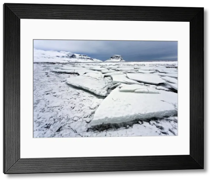 Framed Print : Winter view over slabs of broken lake ice covered in snow towards Kirkjufell (Church Mountain), near Grundarfjordur, Snaefellsnes Peninsula, Iceland, Polar Regions Framed Print : Winter view over slabs of broken lake ice covered in snow towards Kirkjufell (Church Mountain), near Grundarfjordur, Snaefellsnes Peninsula, Iceland, Polar Regions