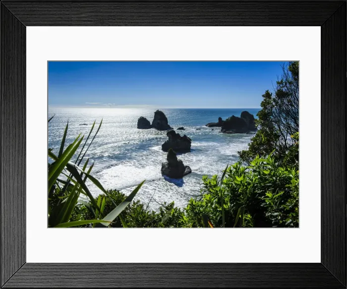 Framed Print : Rocky outcrops in the ocean along the road between Greymouth and Westport, West Coast, South Island, New Zealand, Pacific Framed Print : Rocky outcrops in the ocean along the road between Greymouth and Westport, West Coast, South Island, New Zealand, Pacific