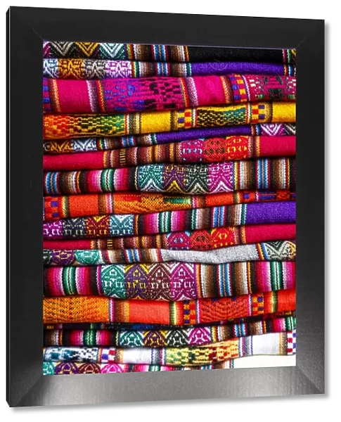 Colorful carpets made of llama and alpaca wool for sale at San Pedro market, Cuzco, Peru
