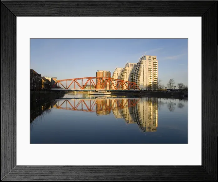 Framed Print : Residential tower blocks and colourful bridge reflected in water, Salford Quays, Salford, Greater Manchester, England, United Kingdom, Europe Framed Print : Residential tower blocks and colourful bridge reflected in water, Salford Quays, Salford, Greater Manchester, England, United Kingdom, Europe