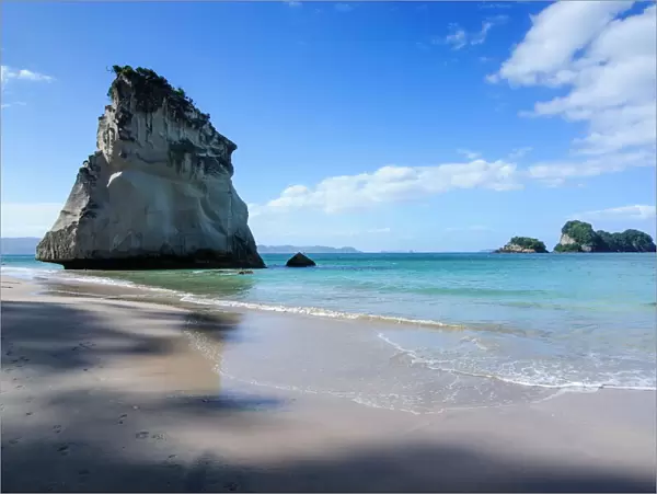Giant rock on the sandy beach of Cathedral Cove, Coromandel, North Island, New Zealand, Pacific