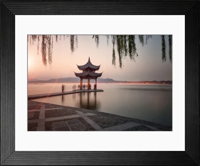 Framed Print : Visitors are taking the last shots with a pagoda at West Lake as the sun is sinking, Hangzhou, Zhejiang, China, Asia