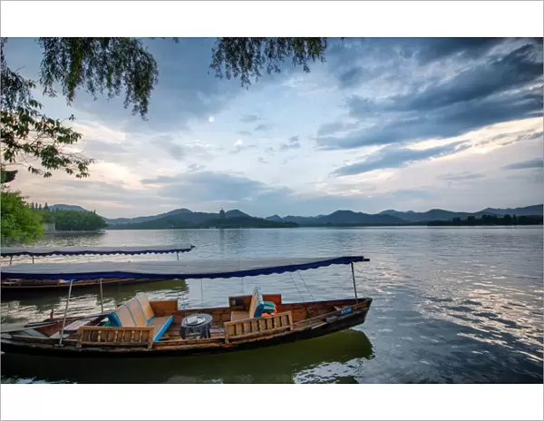 Boats at West Lake shore in Hangzhou, Zhejiang, China, Asia