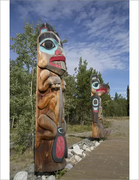 Totem poles with beaver image in the foreground, Teslin Tlingit Heritage Center, Teslin, Yukon, Canada, North America