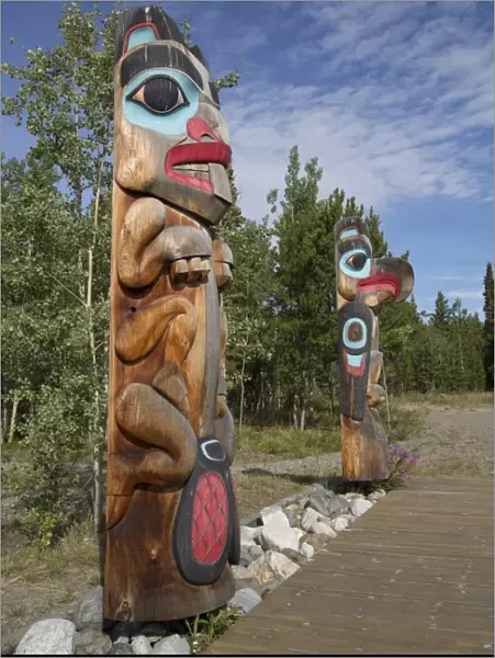 Totem poles with beaver image in the foreground, Teslin Tlingit Heritage Center, Teslin, Yukon, Canada, North America