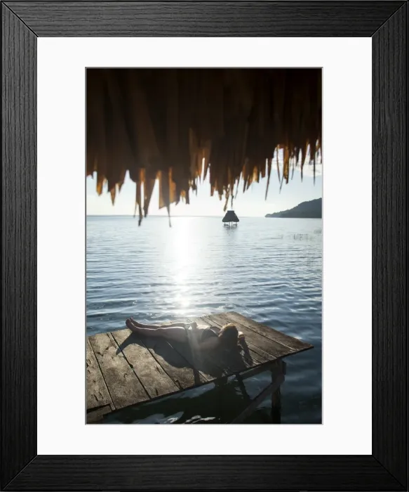 Framed Print : Woman relaxing on dock, El Remate, Lago Peten Itza, Guatemala, Central America Framed Print : Woman relaxing on dock, El Remate, Lago Peten Itza, Guatemala, Central America