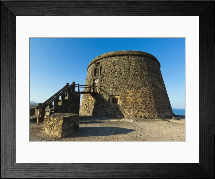 Framed Print : Old tower (toston), a defence against English pirates at this northwest coast village, El Cotillo, Fuerteventura, Canary Islands, Spain, Europe Framed Print : Old tower (toston), a defence against English pirates at this northwest coast village, El Cotillo, Fuerteventura, Canary Islands, Spain, Europe