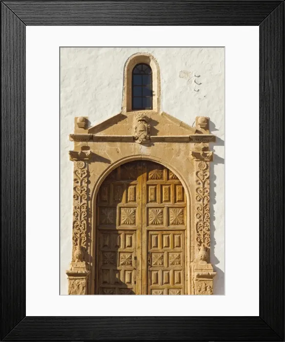 Framed Print : Doorway of beautiful 17th century Santa Maria Cathedral in this historic former capital, Betancuria, Fuerteventura, Canary Islands, Spain, Europe Framed Print : Doorway of beautiful 17th century Santa Maria Cathedral in this historic former capital, Betancuria, Fuerteventura, Canary Islands, Spain, Europe
