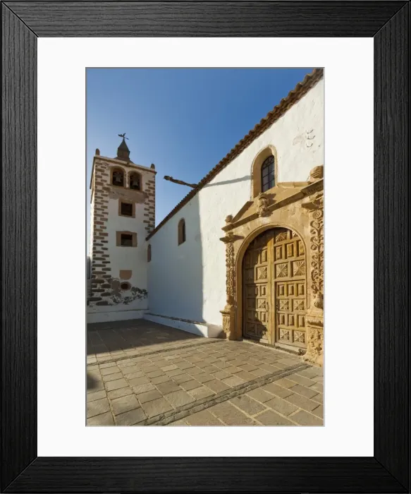 Framed Print : Door and belltower of the 17th century Santa Maria Cathedral in this historic former capital, Betancuria, Fuerteventura, Canary Islands, Spain, Europe Framed Print : Door and belltower of the 17th century Santa Maria Cathedral in this historic former capital, Betancuria, Fuerteventura, Canary Islands, Spain, Europe