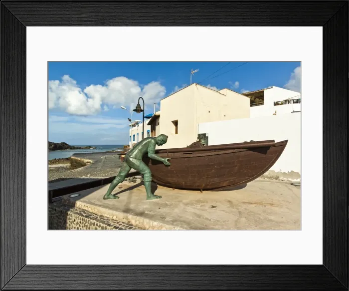 Framed Print : Boat with statues of fishermen at the old harbour in this north west coast village, El Cotillo, Fuerteventura, Canary Islands, Spain, Atlantic, Europe Framed Print : Boat with statues of fishermen at the old harbour in this north west coast village, El Cotillo, Fuerteventura, Canary Islands, Spain, Atlantic, Europe