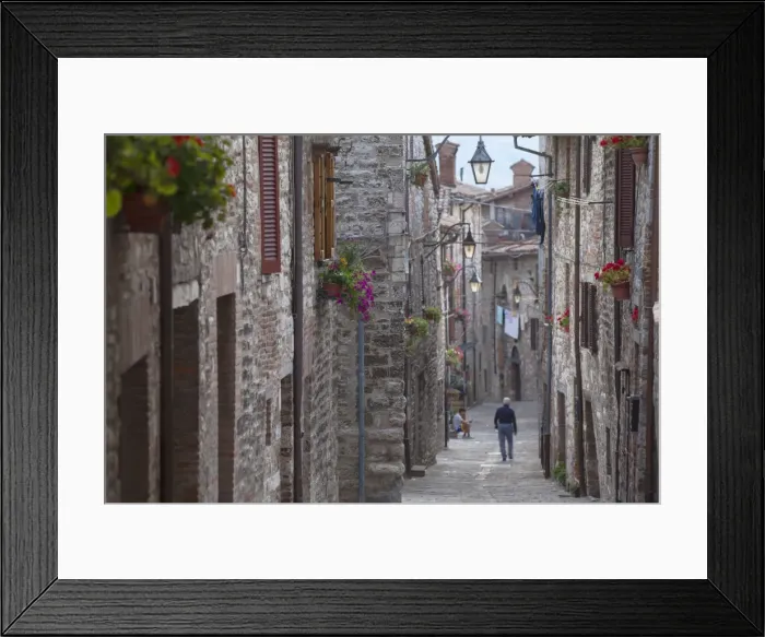Framed Print : Man walking along Via Aquilante, Gubbio, Umbria, Italy, Europe Framed Print : Man walking along Via Aquilante, Gubbio, Umbria, Italy, Europe