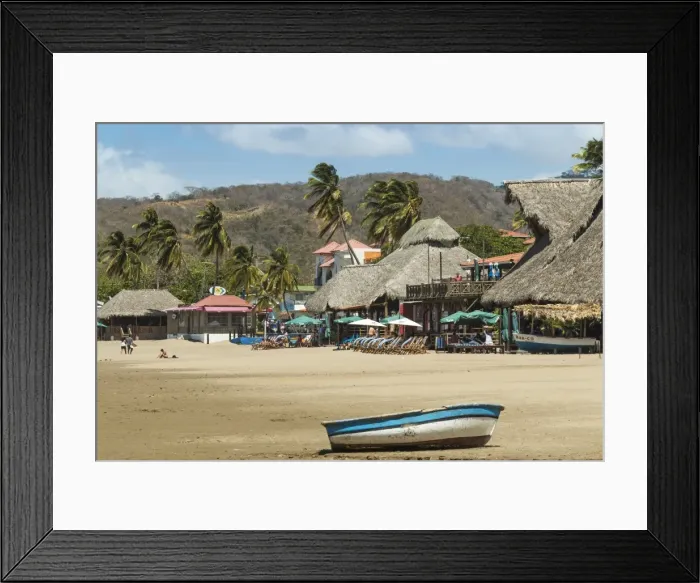Framed Print : Little boat on the beach at this popular tourist hub for the southern surf coast, San Juan del Sur, Rivas Province, Nicaragua, Central America