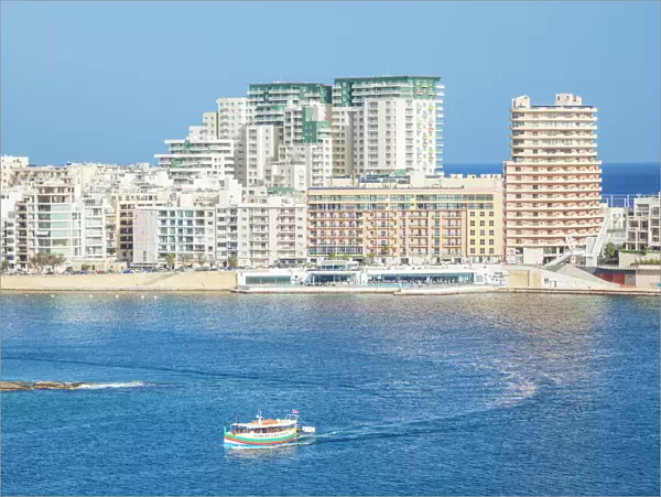 Sliema skyline, Marsamxett Harbour, and tourist boat, Valletta, Malta, Mediterranean, Europe