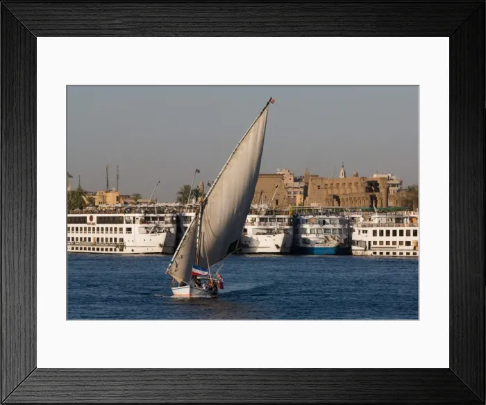 Framed Print : Traditional felucca sailing boat and cruise boats on the River Nile near Luxor, Egypt, North Africa, Africa Framed Print : Traditional felucca sailing boat and cruise boats on the River Nile near Luxor, Egypt, North Africa, Africa