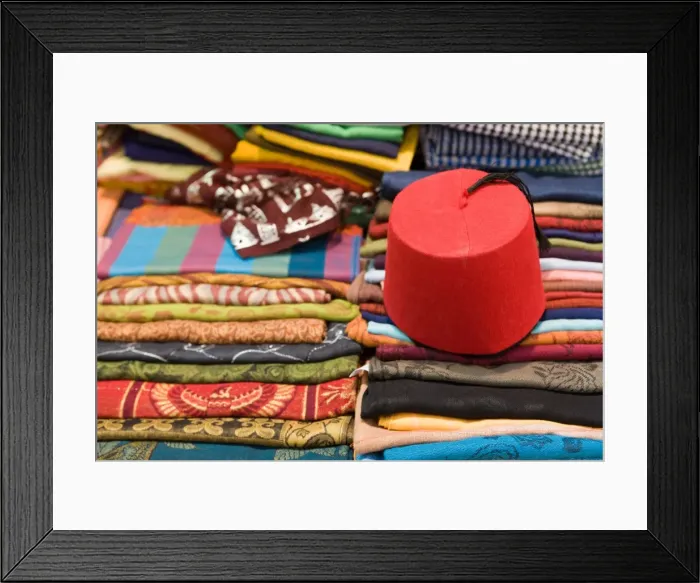 Framed Print : Colourful cotton fabric and a traditional fez for sale in a shop in Luxor, Egypt, North Africa, Africa Framed Print : Colourful cotton fabric and a traditional fez for sale in a shop in Luxor, Egypt, North Africa, Africa