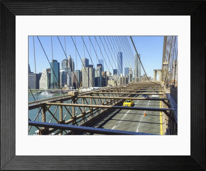 Framed Print : Yellow taxi cab crossing Brooklyn Bridge with the Lower Manhattan skyline behind, New York City, New York, United States of America, North America Framed Print : Yellow taxi cab crossing Brooklyn Bridge with the Lower Manhattan skyline behind, New York City, New York, United States of America, North America