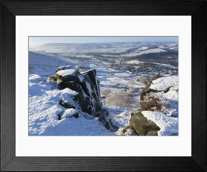 Framed Print : Snowy Curbar village beyond the rocks of Curbar Edge, winter morning, Peak District National Park, Derbyshire, England, United Kingdom, Europe Framed Print : Snowy Curbar village beyond the rocks of Curbar Edge, winter morning, Peak District National Park, Derbyshire, England, United Kingdom, Europe