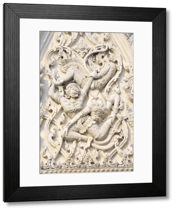 Framed Print : Detail of battling demons on Khmer style Wat Mahathat Worawihan temple in Phetchaburi, Thailand, Southeast Asia, Asia Framed Print : Detail of battling demons on Khmer style Wat Mahathat Worawihan temple in Phetchaburi, Thailand, Southeast Asia, Asia