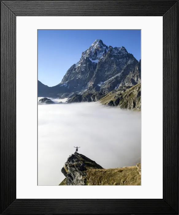 Framed Print : A hiker contemplating the Monviso Massif rising above a bed of clouds in the Cottian Alps, Piedmont, Italy, Europe Framed Print : A hiker contemplating the Monviso Massif rising above a bed of clouds in the Cottian Alps, Piedmont, Italy, Europe