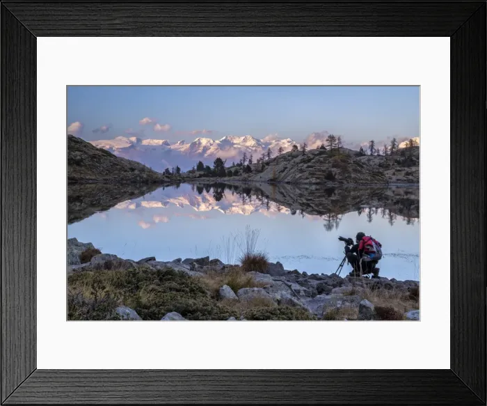 Framed Print : A photographer contemplating the sunset over the Monte Rosa from the Lake Bianco in the Mont Avic Natural Park, Aosta Valley, Italy, Europe Framed Print : A photographer contemplating the sunset over the Monte Rosa from the Lake Bianco in the Mont Avic Natural Park, Aosta Valley, Italy, Europe