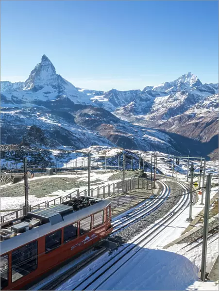 A train from Zermatt approaching the Gornergrat Station facing the majestic shape of the Matterhorn, Valais, Switzerland, Europe
