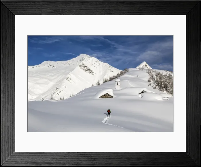 Framed Print : A hiker trying to approach the little village at the Scima Alp covered in snow, Valchiavenna, Lombardy, Italy, Europe Framed Print : A hiker trying to approach the little village at the Scima Alp covered in snow, Valchiavenna, Lombardy, Italy, Europe