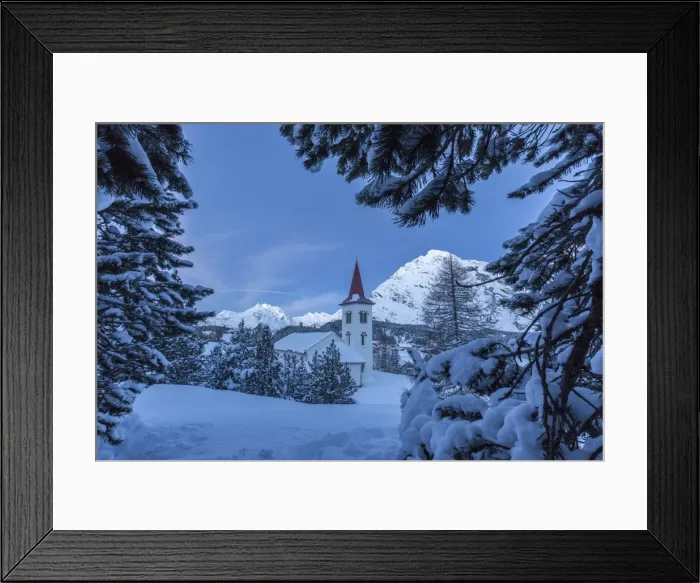 Framed Print : Tree branches covered in snow trying to hide the tiny church at the Maloja Pass, in the fairy-tale landscape of Engadine Valley, Graubunden, Swiss Alps, Switzerland, Europe Framed Print : Tree branches covered in snow trying to hide the tiny church at the Maloja Pass, in the fairy-tale landscape of Engadine Valley, Graubunden, Swiss Alps, Switzerland, Europe