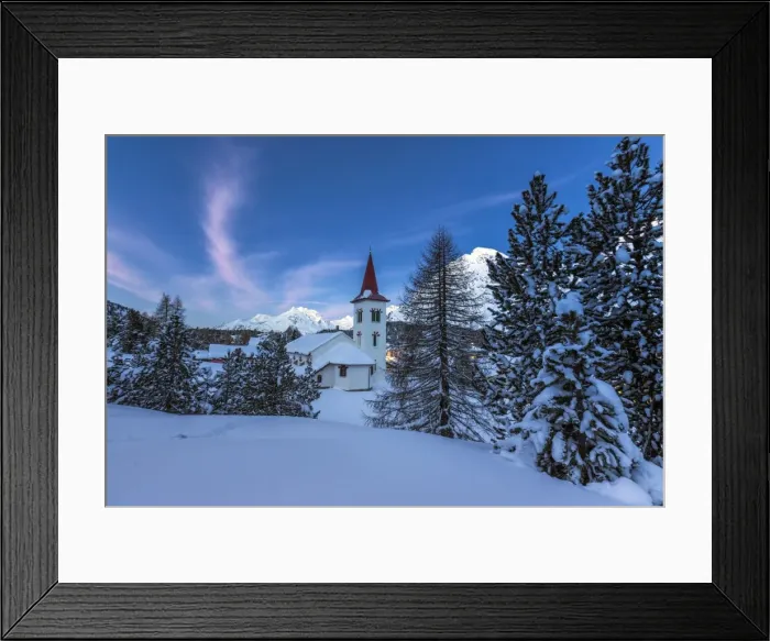 Framed Print : The white church of Maloja Pass in the winter fairy-tale landscape of the Engadine Valley at the blue hour, Graubunden, Switzerland, Europe Framed Print : The white church of Maloja Pass in the winter fairy-tale landscape of the Engadine Valley at the blue hour, Graubunden, Switzerland, Europe