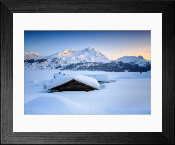 Framed Print : Some scattered huts in a snowy landscape at Spluga by the Maloja Pass with the magical colors of the sunset, Graubunden, Swiss Alps, Switzerland, Europe Framed Print : Some scattered huts in a snowy landscape at Spluga by the Maloja Pass with the magical colors of the sunset, Graubunden, Swiss Alps, Switzerland, Europe