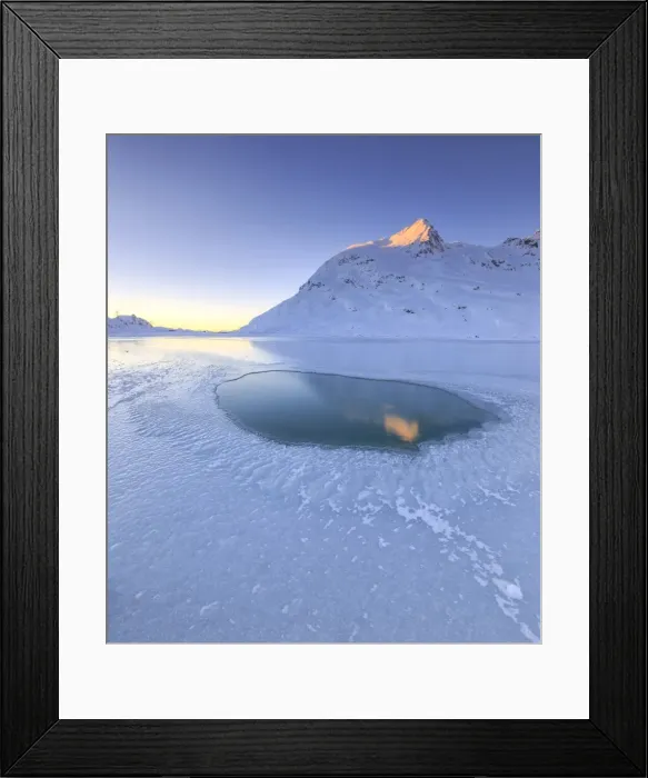 Framed Print : The sun illuminating a peak surrounding the frozen Lago Bianco by Bernina, reflecting in a pool in the center of the lake, Bernina Pass, Graubunden, Swiss Alps, Switzerland, Europe Framed Print : The sun illuminating a peak surrounding the frozen Lago Bianco by Bernina, reflecting in a pool in the center of the lake, Bernina Pass, Graubunden, Swiss Alps, Switzerland, Europe