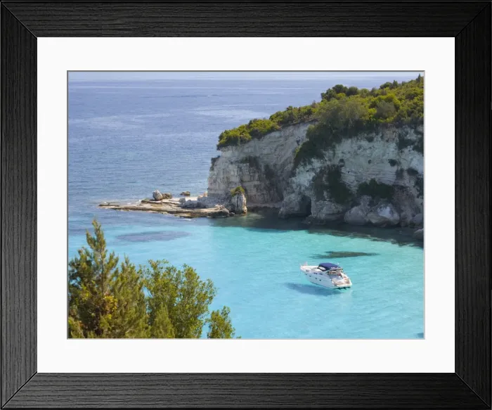 Framed Print : View from hillside over secluded Voutoumi Bay, solitary boat at anchor, Antipaxos, Paxi, Corfu, Ionian Islands, Greek Islands, Greece, Europe Framed Print : View from hillside over secluded Voutoumi Bay, solitary boat at anchor, Antipaxos, Paxi, Corfu, Ionian Islands, Greek Islands, Greece, Europe