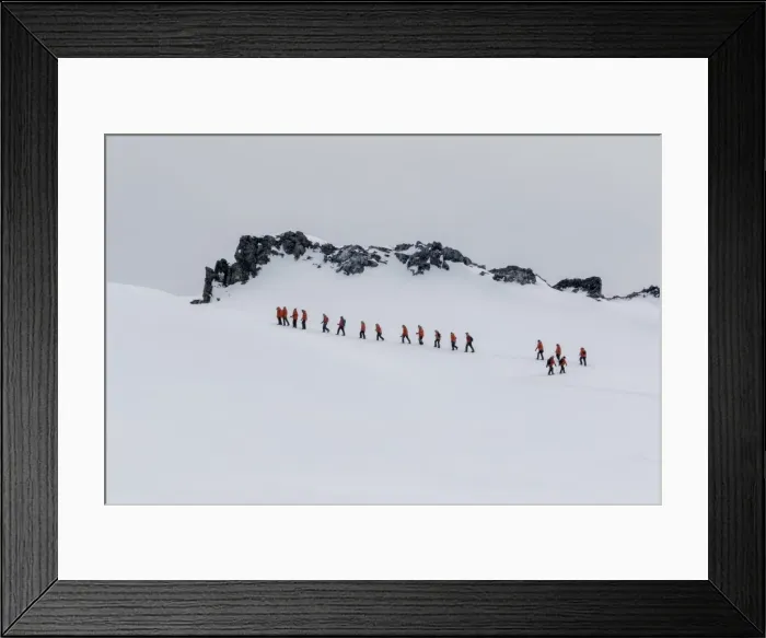 Framed Print : Lindblad Expeditions guests from the National Geographic Explorer hiking at Orne Harbor Framed Print : Lindblad Expeditions guests from the National Geographic Explorer hiking at Orne Harbor