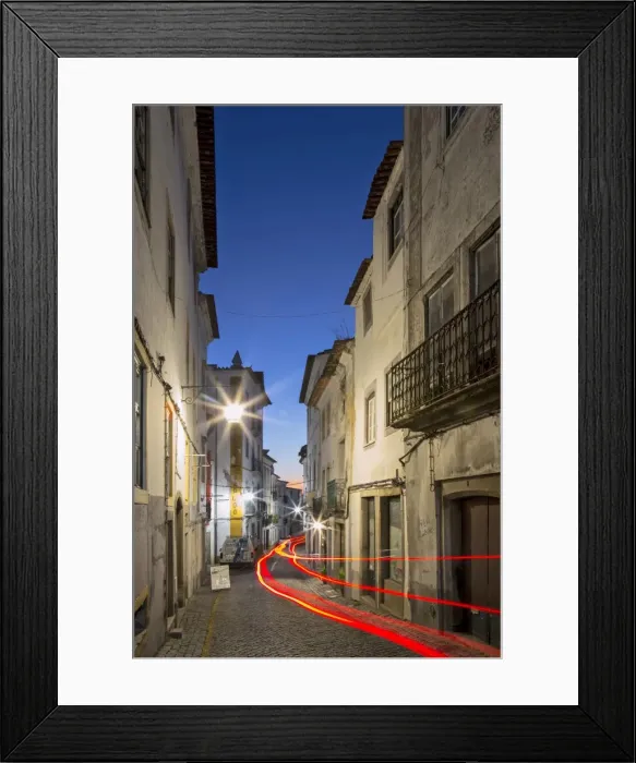 Framed Print : View along the medieval cobbled street of Rua dos Mercadores historic centre of Evora Framed Print : View along the medieval cobbled street of Rua dos Mercadores historic centre of Evora