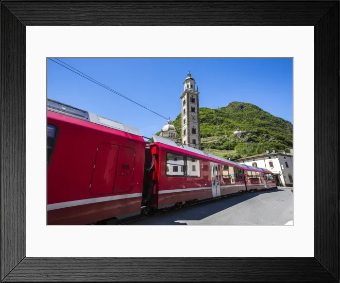 Framed Print : The Bernina Express train passes near the Sanctuary of Madonna di Tirano, not far Framed Print : The Bernina Express train passes near the Sanctuary of Madonna di Tirano, not far