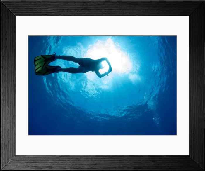 Framed Print : Free diving snorkeller and sunburst on the Great Barrier Reef, UNESCO World Heritage Site Framed Print : Free diving snorkeller and sunburst on the Great Barrier Reef, UNESCO World Heritage Site