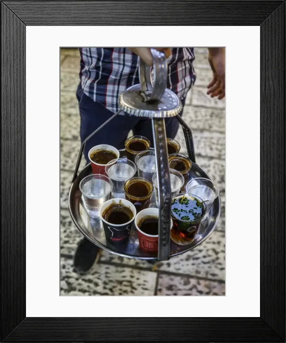 Framed Print : Young man holding a tray with coffee, tea and water in old city, Jerusalem, Israel