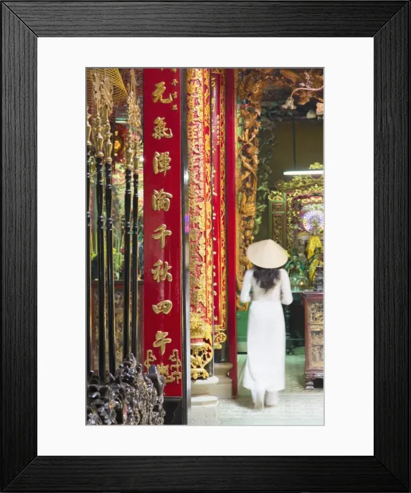 Framed Print : Woman wearing ao dai dress at Phuoc An Hoi Quan Pagoda, Cholon, Ho Chi Minh City Framed Print : Woman wearing ao dai dress at Phuoc An Hoi Quan Pagoda, Cholon, Ho Chi Minh City