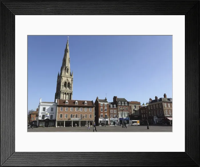 Framed Print : The spire of St. Mary Magdalene church rises over building on the Market Square in Framed Print : The spire of St. Mary Magdalene church rises over building on the Market Square in