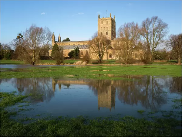 Tewkesbury Abbey reflected in flooded meadow, Tewkesbury, Gloucestershire, England