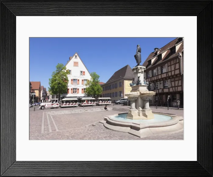 Framed Print : Tourist train, Fontaine Roesselmann, Place des Six-Montagnes-Noires, Colmar, Alsace Framed Print : Tourist train, Fontaine Roesselmann, Place des Six-Montagnes-Noires, Colmar, Alsace
