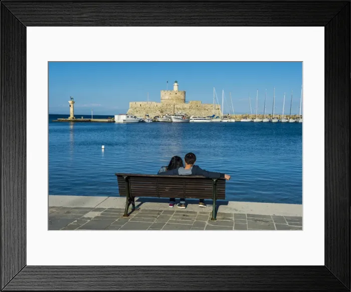 Framed Print : The old Agios Nikolaos fortress and lighthouse in Mandraki Harbour, Rhodes Town, Rhodes Framed Print : The old Agios Nikolaos fortress and lighthouse in Mandraki Harbour, Rhodes Town, Rhodes